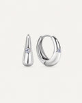 Pair of silver Audrey teardrop huggie earrings with one round moissanite accent on each front