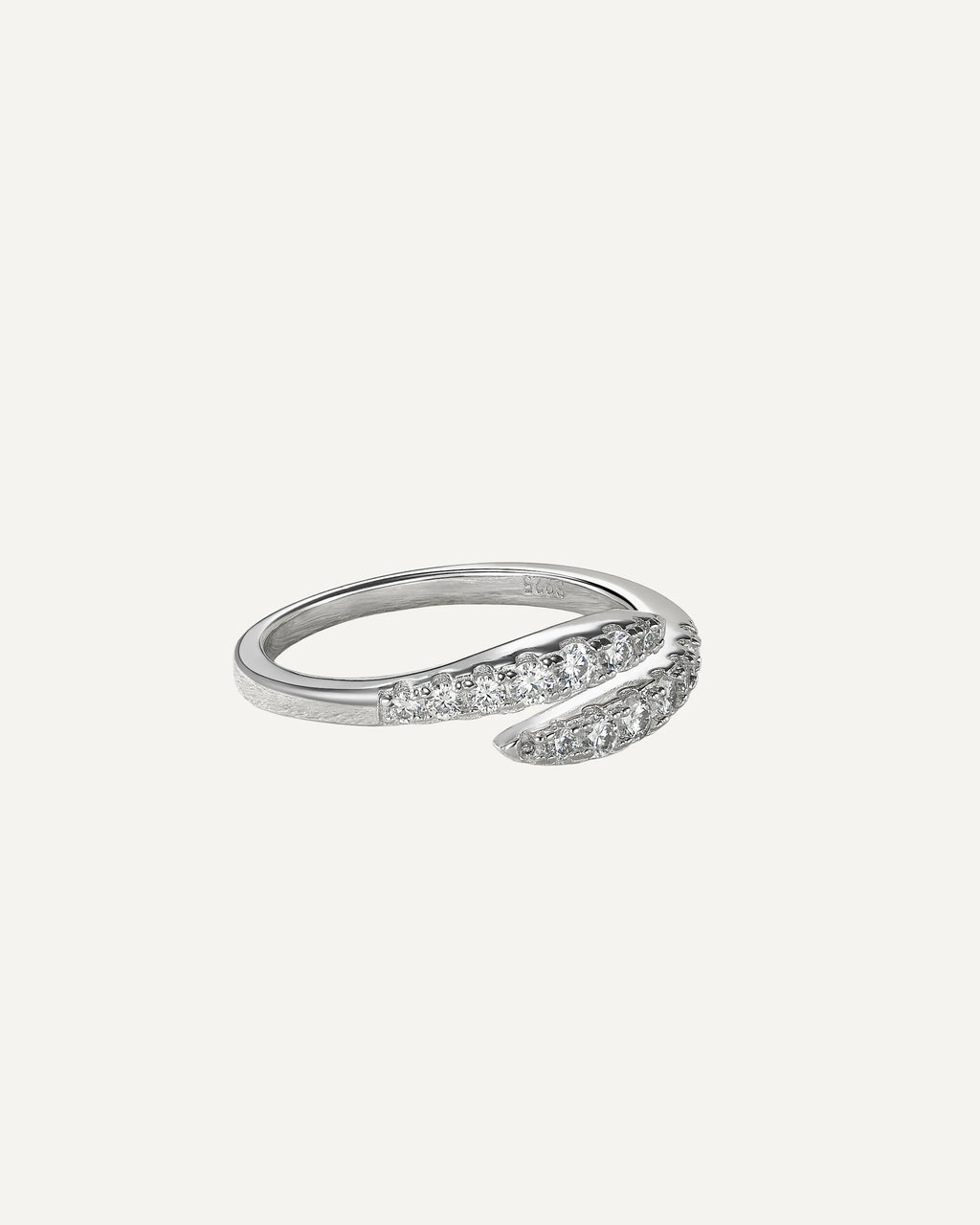 Three-quarter view of the Clara silver open-wrap ring, showing two curved rows of graduated round moissanite stones.