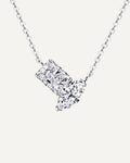 Front view of the silver-tone Elise necklace with rectangular and marquise stones in an asymmetric pendant.