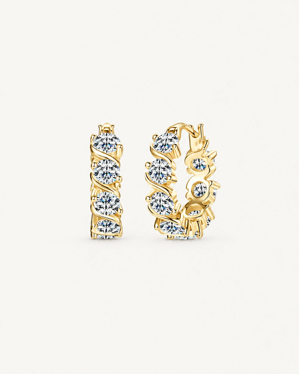 Gold Noelle hoop earrings with round moissanite stones framed by diagonal ribbon settings