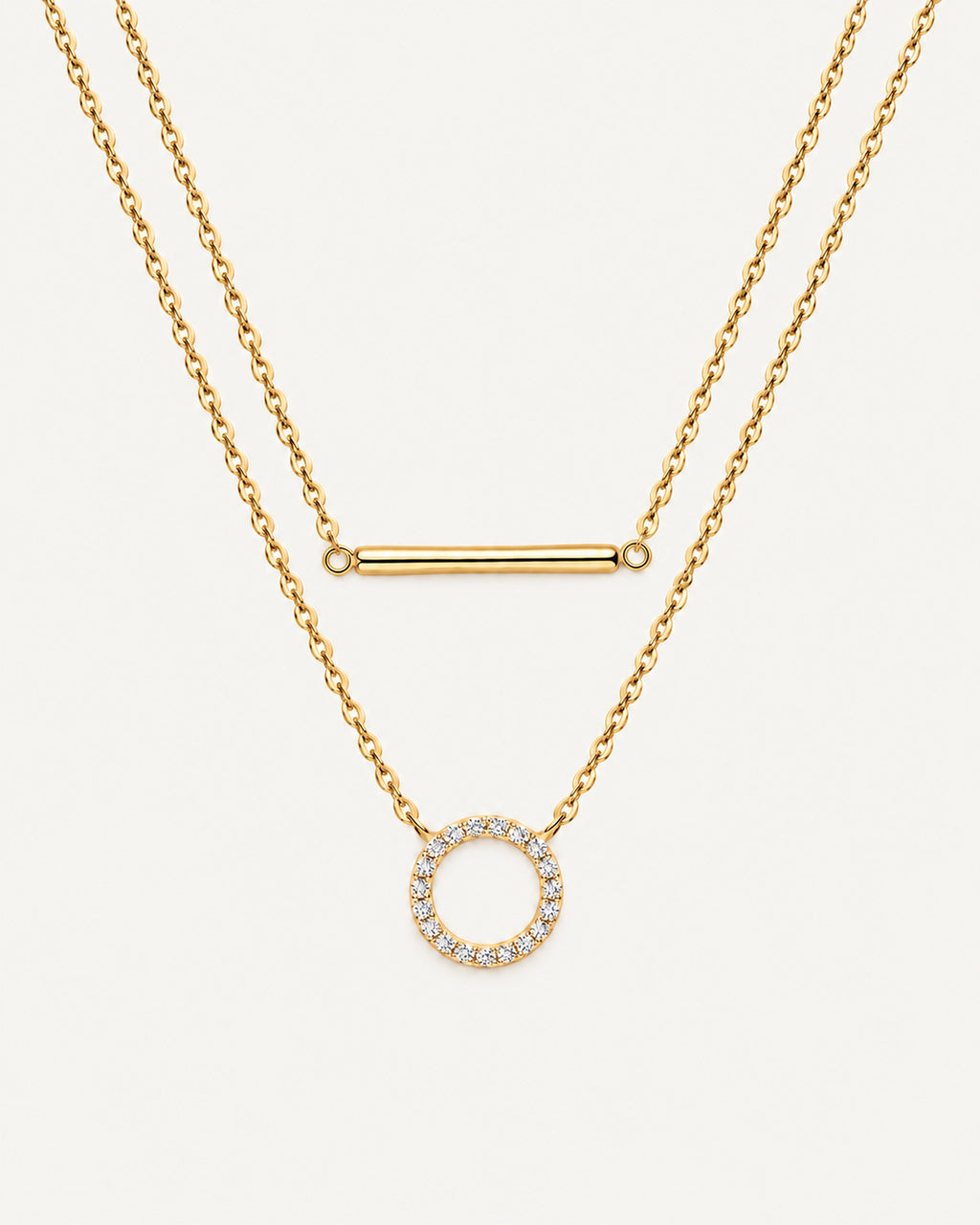 Gold Simone double-layer necklace with a plain horizontal bar above an open moissanite circle